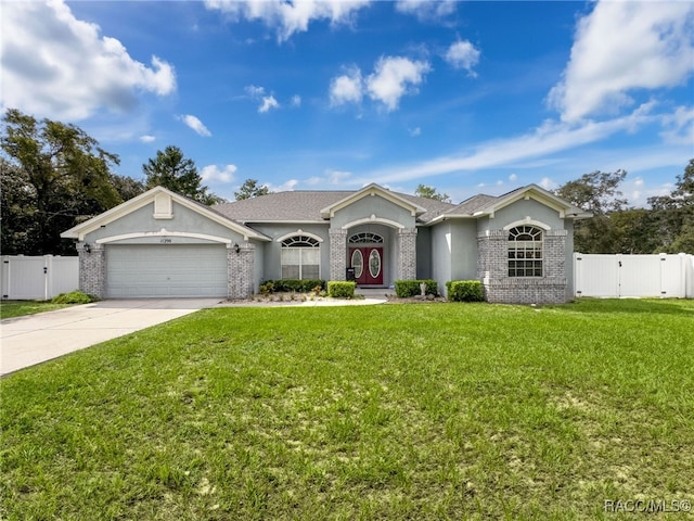 ranch-style house featuring a garage and a front lawn