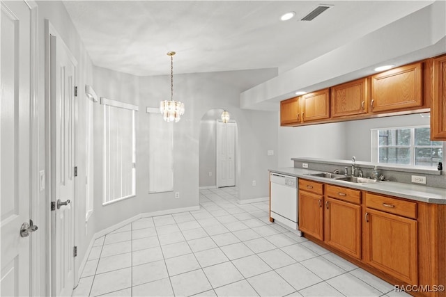 kitchen featuring decorative light fixtures, sink, a chandelier, light tile patterned floors, and white dishwasher