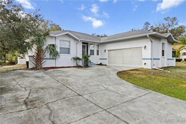 ranch-style home with a garage and a front yard