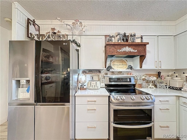 4101 E Gloria Dr, Hernando, FL 34442 - kitchen featuring appliances with stainless steel finishes, a textured ceiling, white cabinets, and light countertops