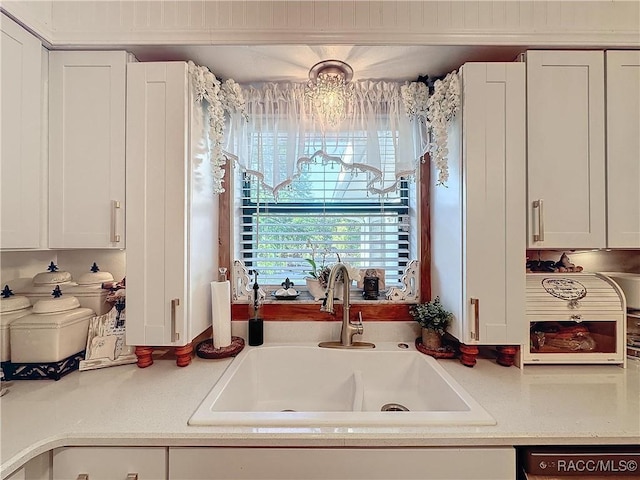 4101 E Gloria Dr, Hernando, FL 34442 - kitchen with light countertops and white cabinetry