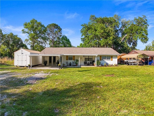 4101 E Gloria Dr, Hernando, FL 34442 - view of front of property with a shed, a front yard, a porch, and an attached carport