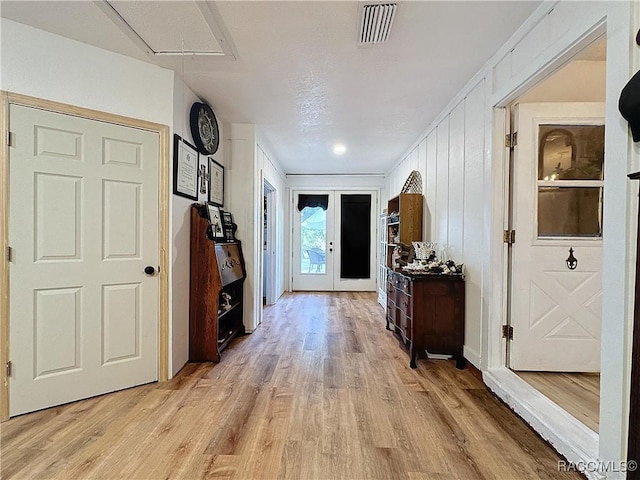 4101 E Gloria Dr, Hernando, FL 34442 - corridor featuring light wood-type flooring and attic access