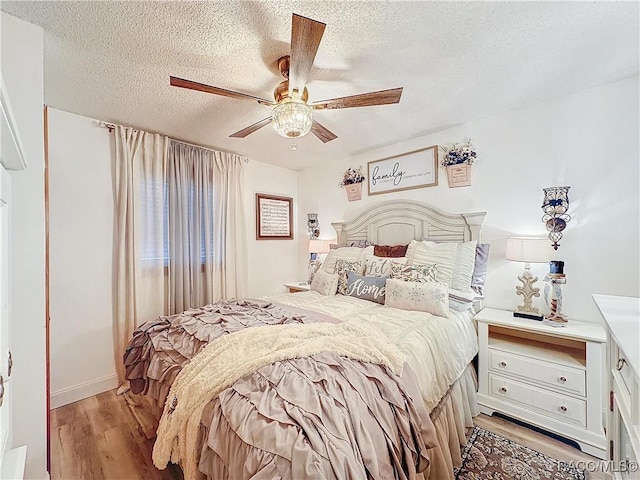 4101 E Gloria Dr, Hernando, FL 34442 - bedroom featuring light wood finished floors, a textured ceiling, and ceiling fan
