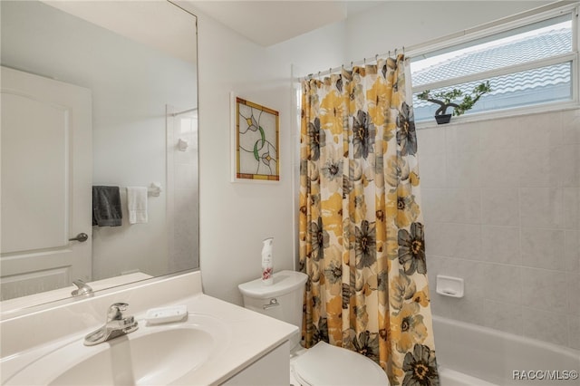 full bathroom with vanity, shower / bathtub combination with curtain, and toilet