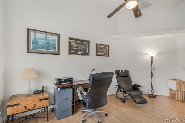 office with hardwood / wood-style flooring and ceiling fan