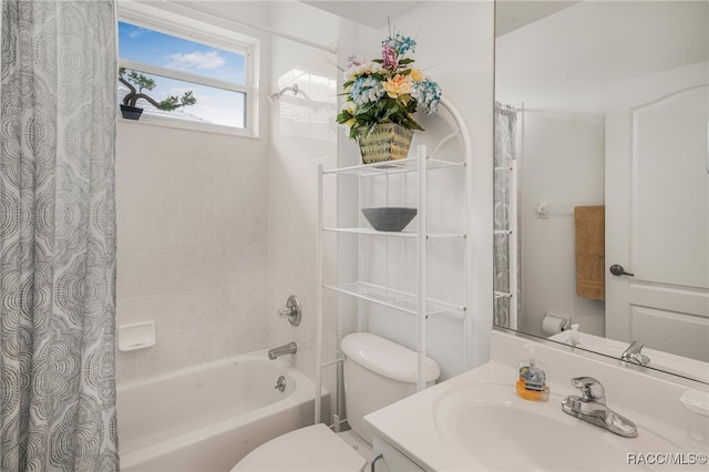 full bathroom featuring vanity, toilet, and shower / tub combo