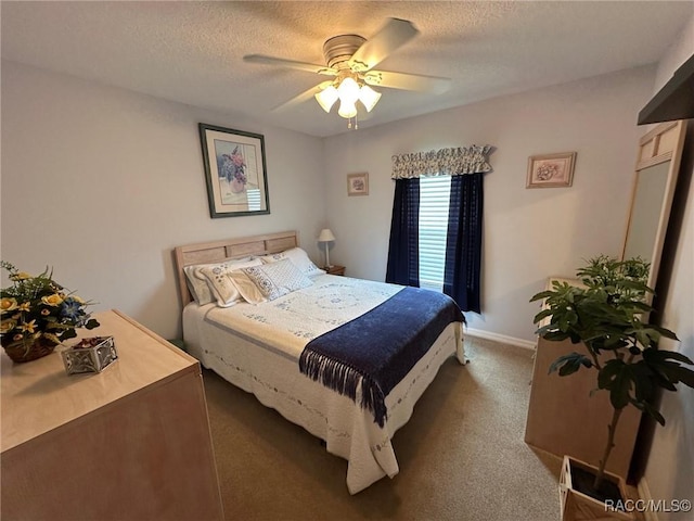carpeted bedroom featuring a textured ceiling, baseboards, and a ceiling fan