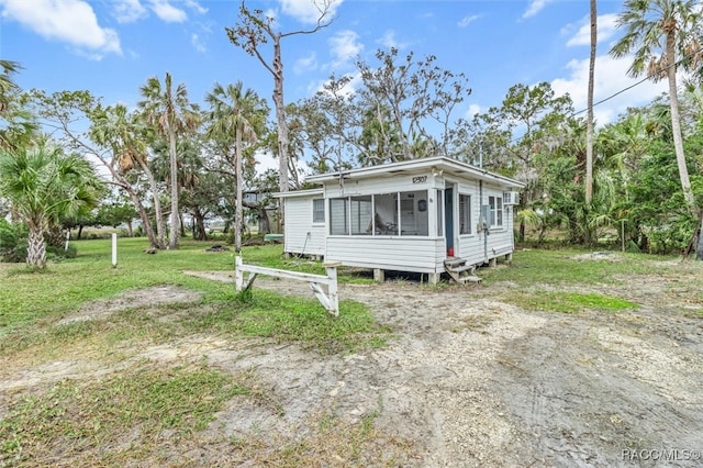 view of front of property with a sunroom