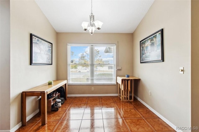 entryway with tile patterned flooring and an inviting chandelier