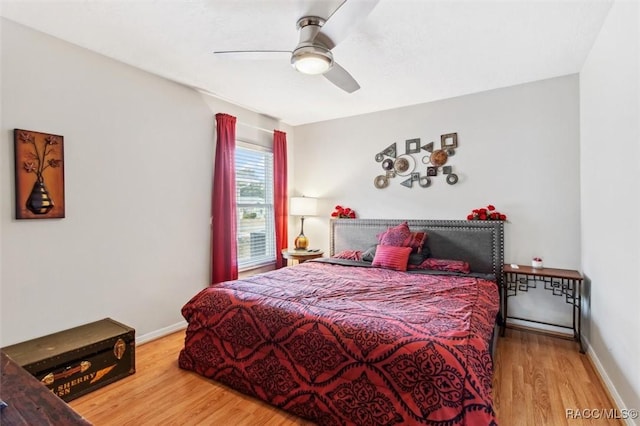 bedroom featuring hardwood / wood-style flooring and ceiling fan