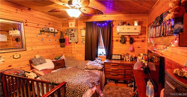 bedroom with wood walls and wooden ceiling