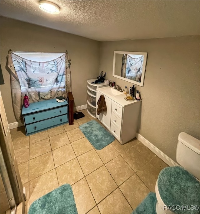 interior space featuring sink and a textured ceiling