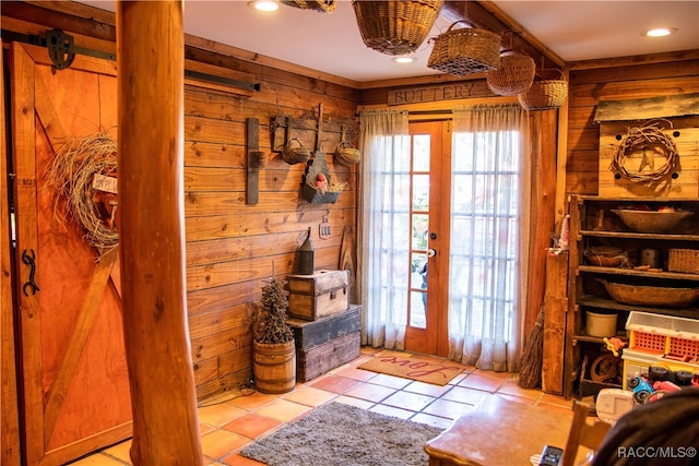 doorway featuring a healthy amount of sunlight, light tile patterned floors, and french doors