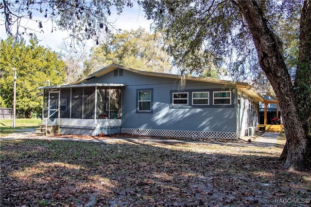 exterior space featuring a sunroom