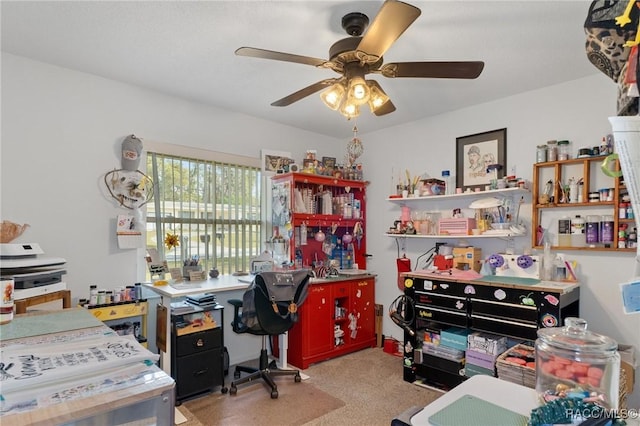 home office with light carpet and ceiling fan