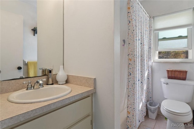 bathroom featuring toilet, tile patterned floors, a shower with shower curtain, and vanity