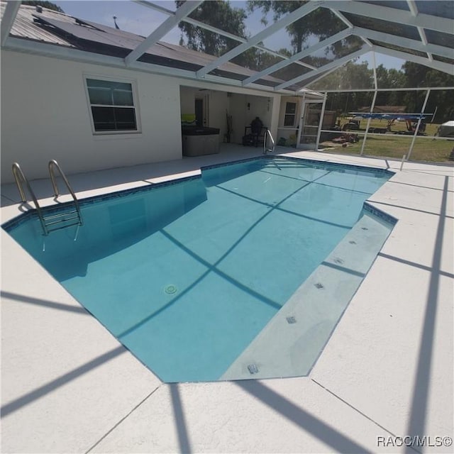 943 Maple Ave, Inverness, FL 34452 - outdoor pool with glass enclosure and a patio area