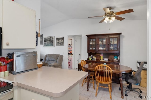 943 Maple Ave, Inverness, FL 34452 - dining area with vaulted ceiling, ceiling fan, and light tile patterned floors