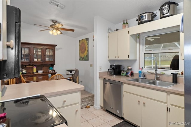 kitchen featuring visible vents, electric range oven, dishwasher, light countertops, and a sink