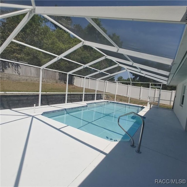 943 Maple Ave, Inverness, FL 34452 - outdoor pool featuring a patio, a lanai, and a fenced backyard