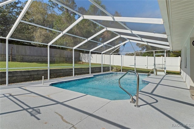 view of pool featuring glass enclosure, a fenced backyard, and a patio