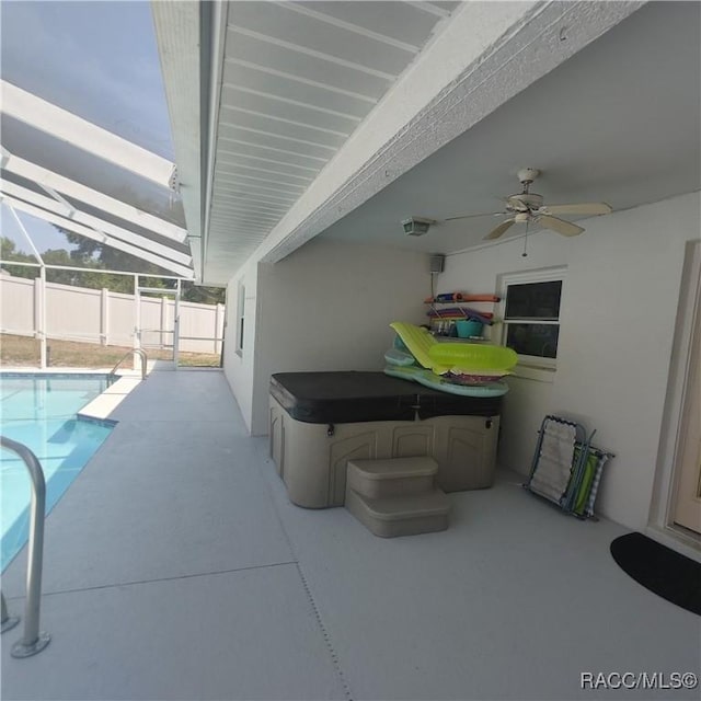 943 Maple Ave, Inverness, FL 34452 - view of patio / terrace featuring a fenced in pool, ceiling fan, a hot tub, glass enclosure, and fence