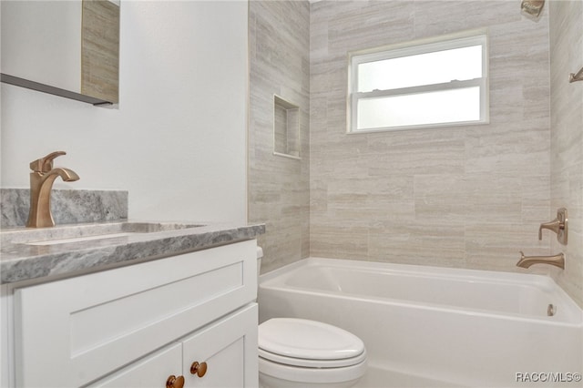 full bathroom featuring vanity, toilet, and tiled shower / bath combo