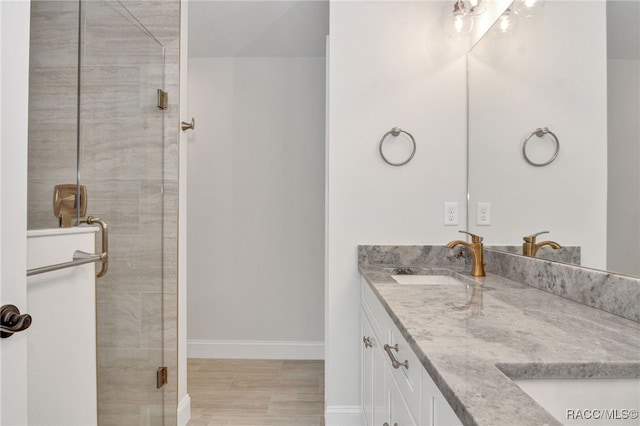 bathroom with vanity and walk in shower