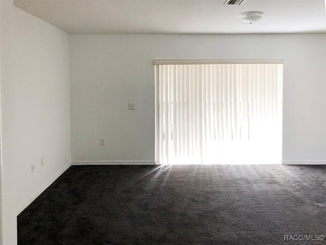 unfurnished room featuring carpet flooring