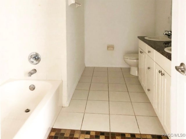 full bathroom featuring vanity, toilet, tub / shower combination, and tile patterned flooring