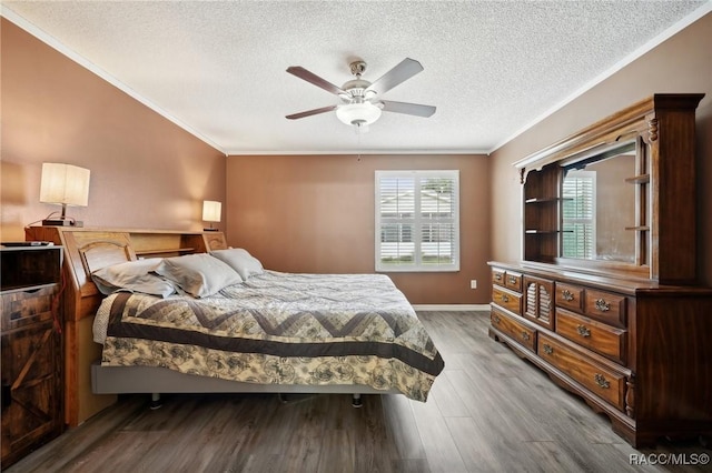 bedroom featuring wood-type flooring, a textured ceiling, ceiling fan, and ornamental molding