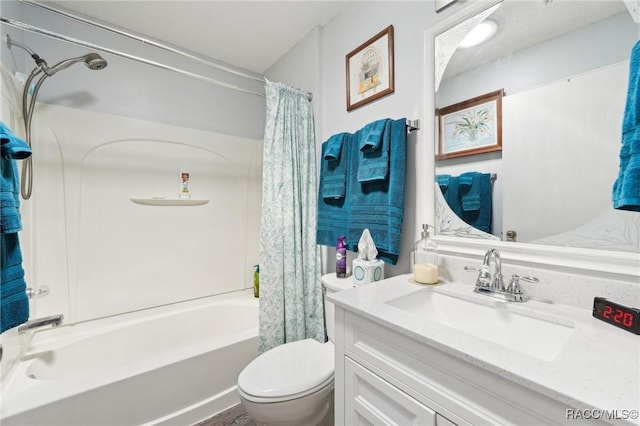 full bathroom with shower / bath combination with curtain, vanity, and toilet