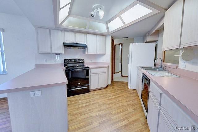 kitchen featuring white cabinets, sink, light hardwood / wood-style flooring, and black appliances