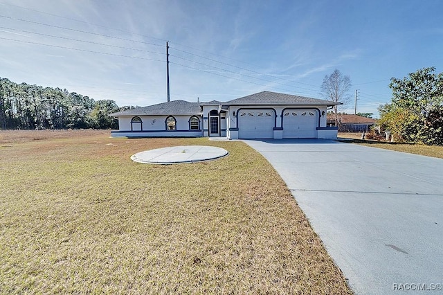 view of front of home with a garage and a front lawn