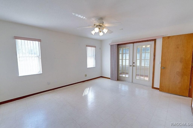 empty room with french doors and ceiling fan