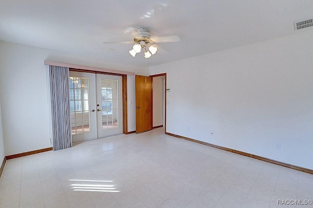 empty room with french doors and ceiling fan