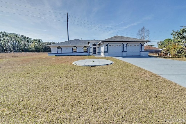 view of front of property with a garage and a front yard