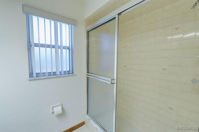 bathroom featuring an enclosed shower