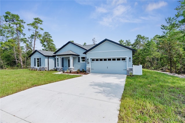 view of front of property with a garage and a front yard