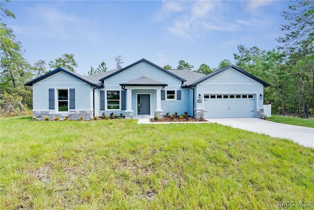 view of front facade with a garage and a front yard