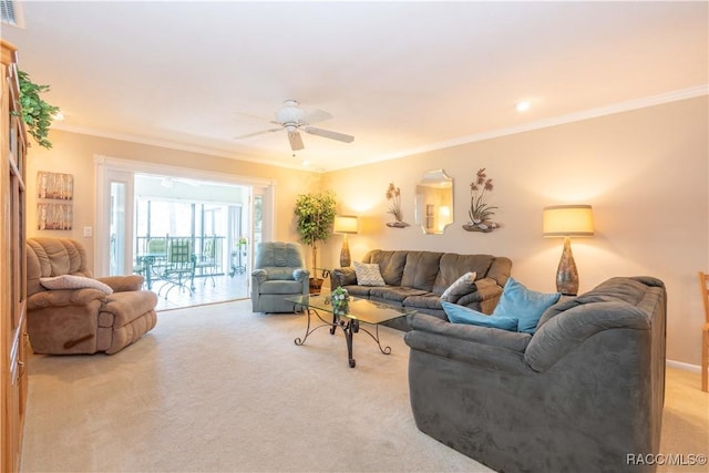 carpeted living room featuring crown molding and ceiling fan