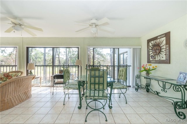 sunroom / solarium featuring ceiling fan