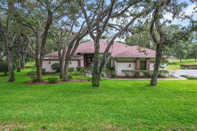 330 E Ireland Ct, Hernando, FL 34442 - single story home with a front yard and concrete driveway