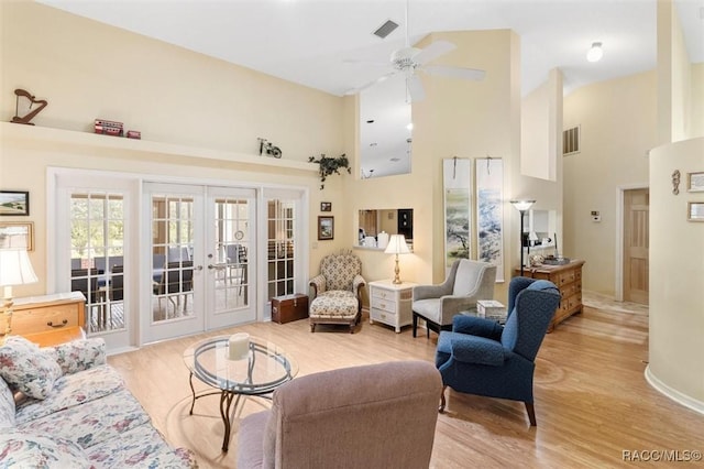 330 E Ireland Ct, Hernando, FL 34442 - living area featuring french doors, a towering ceiling, a ceiling fan, light wood-style floors, and baseboards