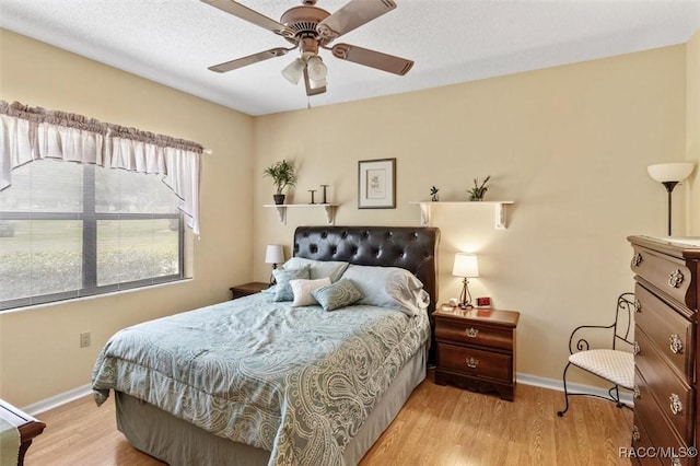 330 E Ireland Ct, Hernando, FL 34442 - bedroom featuring baseboards, wood finished floors, and a ceiling fan