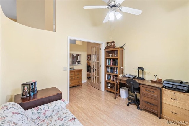 330 E Ireland Ct, Hernando, FL 34442 - home office featuring light wood finished floors, ceiling fan, and a towering ceiling
