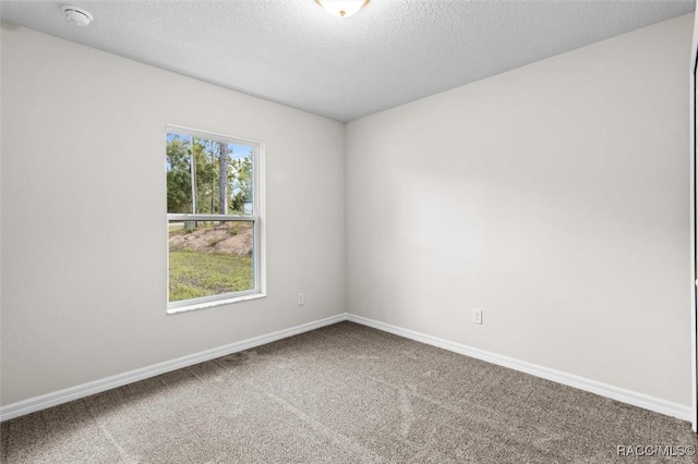 6613 N Bedstrow Blvd, Dunnellon, FL 34434 - carpeted spare room featuring a smoke detector and a textured ceiling