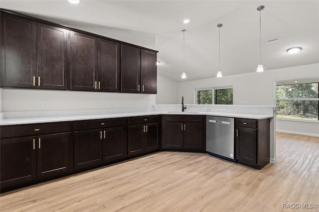 6613 N Bedstrow Blvd, Dunnellon, FL 34434 - kitchen with dishwasher, a peninsula, light wood-style floors, lofted ceiling, and light countertops