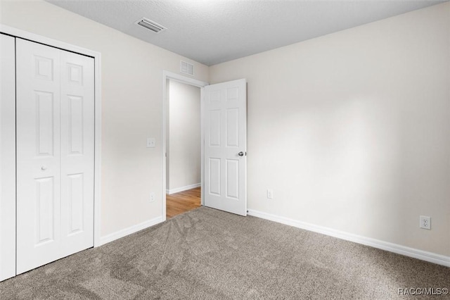 6613 N Bedstrow Blvd, Dunnellon, FL 34434 - unfurnished bedroom featuring carpet and a closet